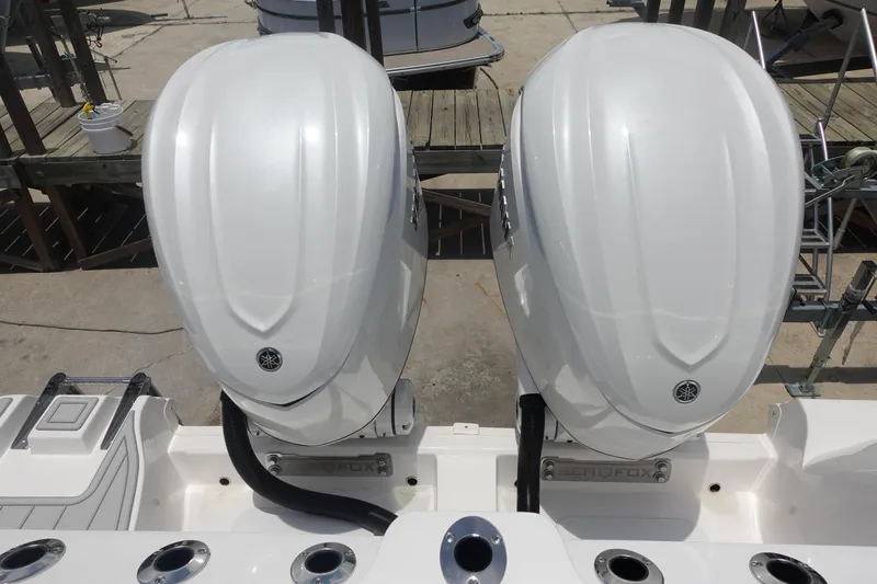  Yacht Photos Pics Twin outboard engines on a 2025 Sea Fox 328 Commander boat, docked at a marina.