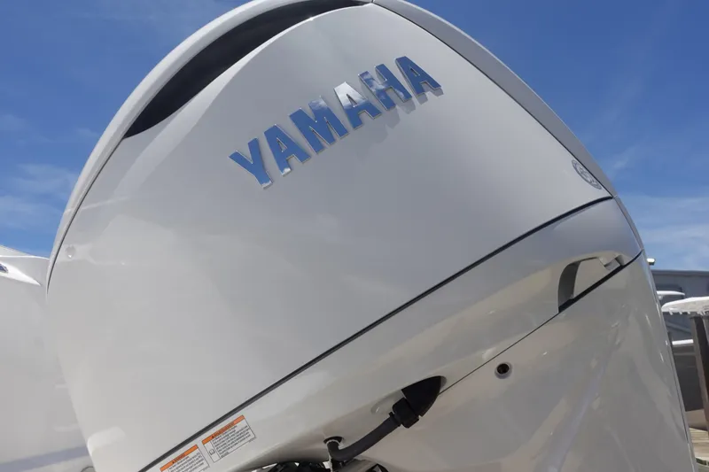  Yacht Photos Pics Yamaha outboard motor on 2025 Sea Fox 328 Commander boat, under clear blue sky.