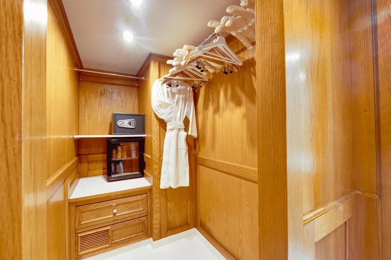 Eva Yacht Photos Pics Luxurious wooden closet in a 1992 Cheoy Lee Custom yacht with safe and robe.