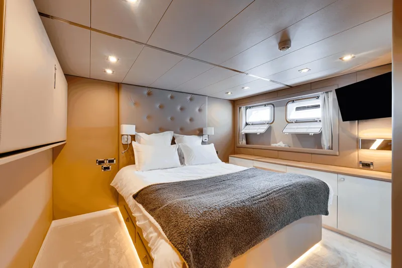 Eva Yacht Photos Pics Luxurious bedroom interior of 1992 Cheoy Lee Custom yacht with modern design and cozy bedding.