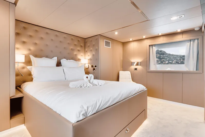 Eva Yacht Photos Pics Luxurious bedroom on a 1992 Cheoy Lee Custom yacht with scenic window view.