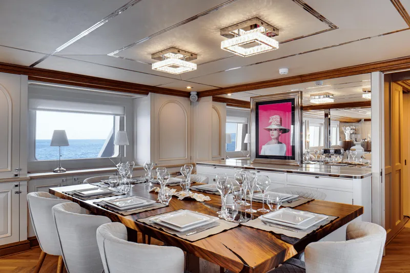 Eva Yacht Photos Pics Luxurious dining area on a 1992 Cheoy Lee Custom yacht with elegant table setting.