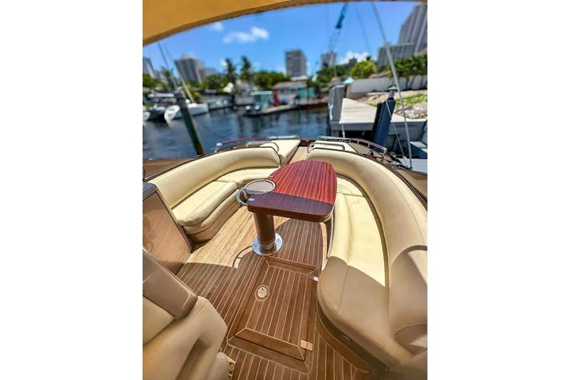  Yacht Photos Pics Luxurious 2005 Riva RivaRama 44 yacht interior with elegant seating and wooden table.