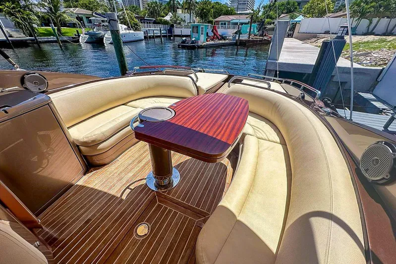  Yacht Photos Pics Luxurious 2005 Riva RivaRama 44 yacht interior with elegant seating and wooden table.