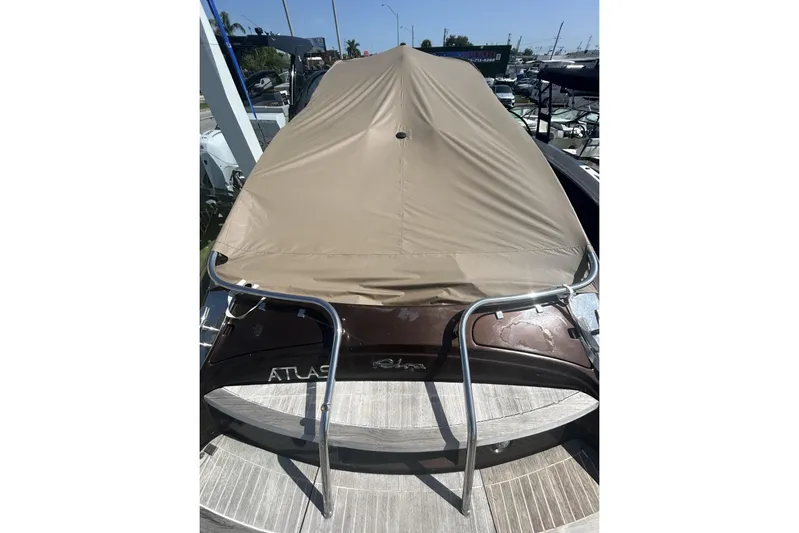  Yacht Photos Pics 2005 Riva RivaRama 44 boat with protective cover, docked in marina.