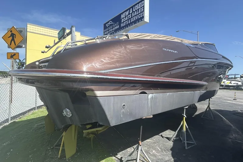 Yacht Photos Pics 2005 Riva RivaRama 44 boat on stands, displayed outdoors under clear blue sky.