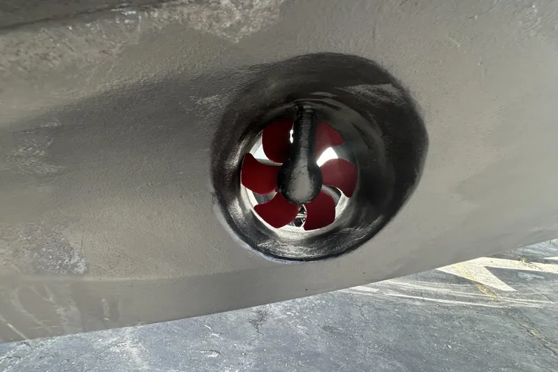  Yacht Photos Pics Close-up of a 2005 Riva RivaRama 44 boat's red propeller in a tunnel.