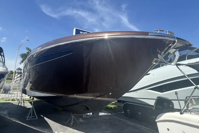  Yacht Photos Pics 2005 Riva RivaRama 44 luxury yacht displayed outdoors under clear blue sky.