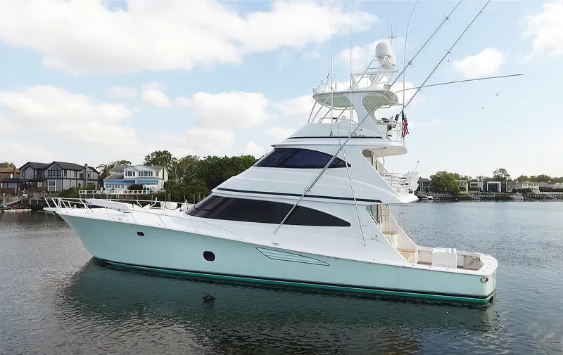 On The Edge Yacht Photos Pics 2018 Viking 80 Enclosed Skybridge yacht on calm water, showcasing sleek design and luxury features.