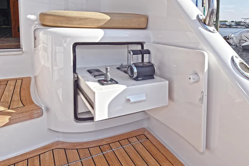 On The Edge Yacht Photos Pics 2018 Viking 80 Enclosed Skybridge yacht with open storage compartment and teak flooring.