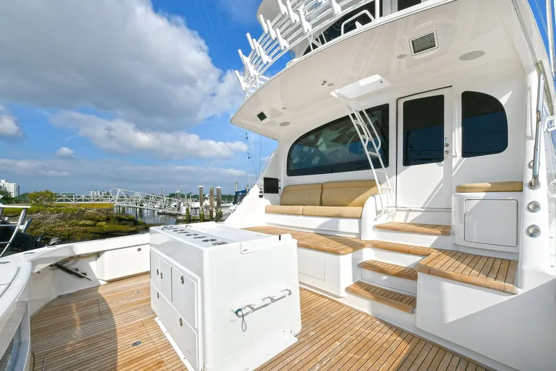 On The Edge Yacht Photos Pics 2018 Viking 80 Enclosed Skybridge yacht with spacious deck and seating area.