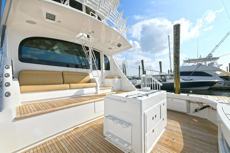 On The Edge Yacht Photos Pics 2018 Viking 80 Enclosed Skybridge yacht with spacious deck and luxurious seating.