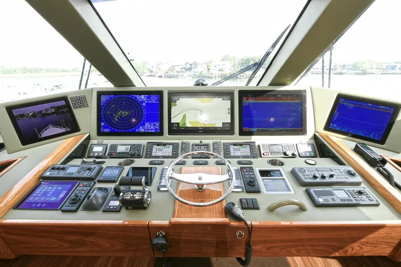 On The Edge Yacht Photos Pics Control panel of 2018 Viking 80 Enclosed Skybridge yacht with advanced navigation displays.