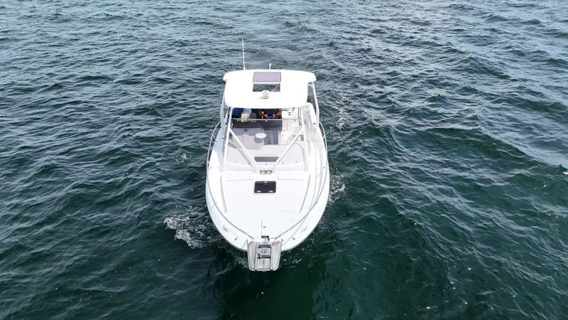  Yacht Photos Pics 2022 Jeanneau Leader 9.0 WA cruising on open water, aerial view.