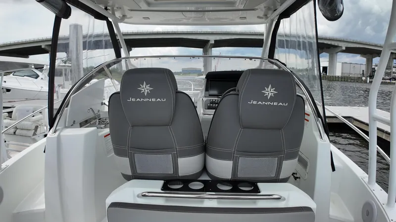  Yacht Photos Pics 2022 Jeanneau Leader 9.0 WA boat interior with dual seats and dashboard view.