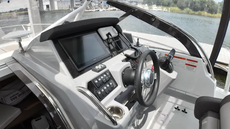  Yacht Photos Pics 2022 Jeanneau Leader 9.0 WA boat cockpit with modern controls and steering wheel.