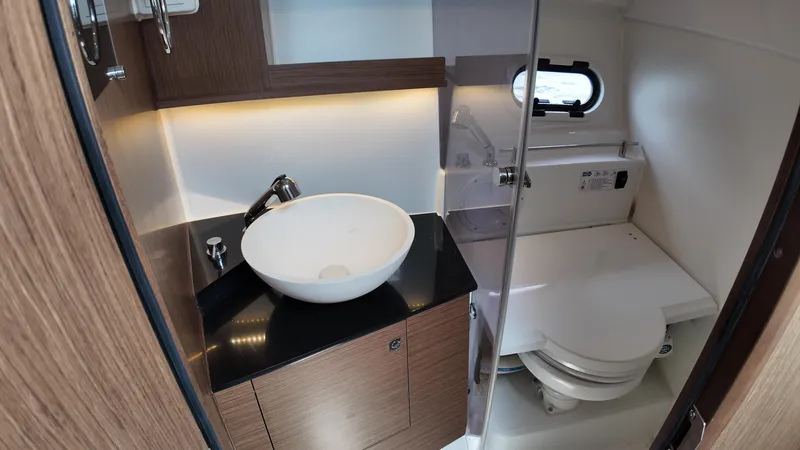  Yacht Photos Pics 2022 Jeanneau Leader 9.0 WA bathroom with modern sink and toilet.