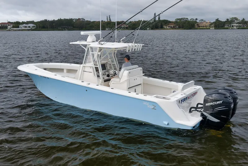  Yacht Photos Pics 2023 SeaVee 322Z boat on water with dual Mercury engines, light blue hull.