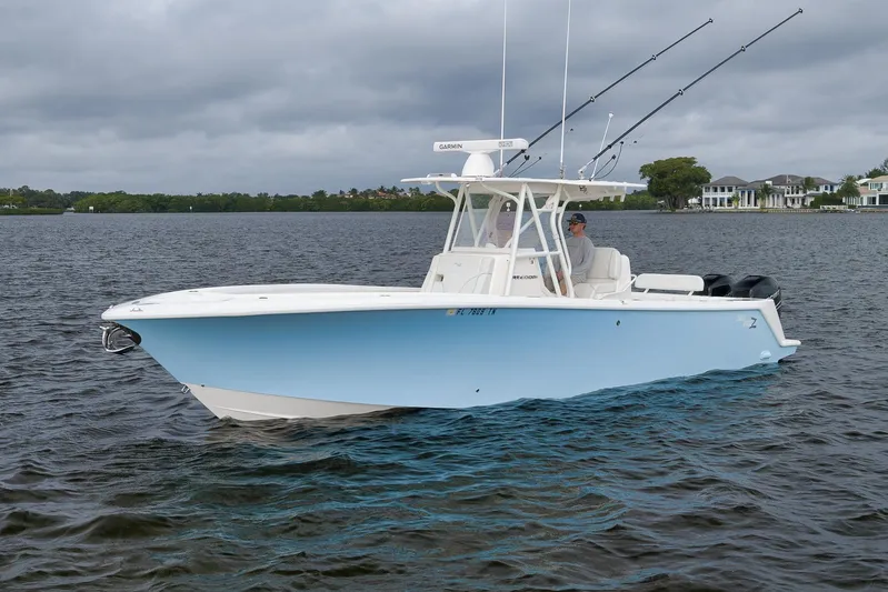  Yacht Photos Pics 2023 SeaVee 322Z boat on water, featuring fishing rods and modern design.