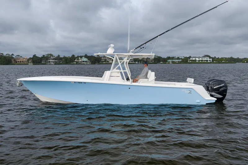  Yacht Photos Pics 2023 SeaVee 322Z boat on water, featuring sleek design and powerful Mercury engines.