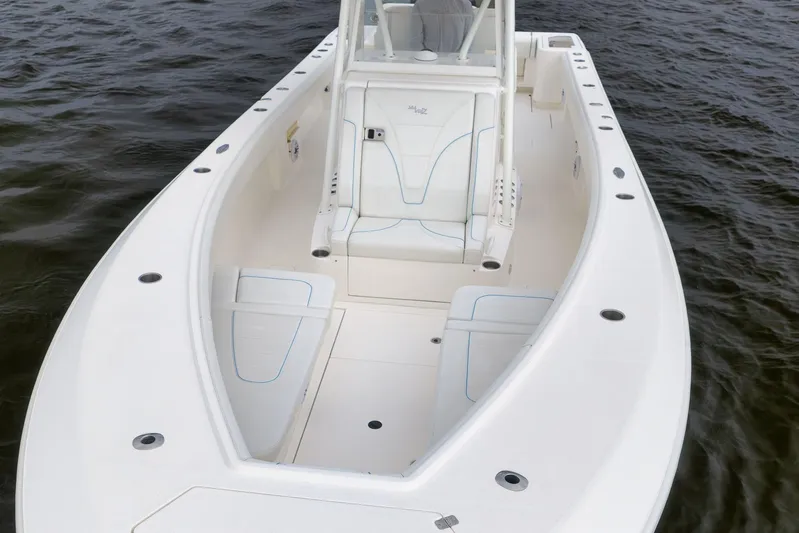  Yacht Photos Pics 2023 SeaVee 322Z boat with spacious deck and seating on calm water.