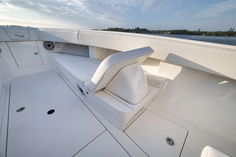  Yacht Photos Pics 2023 SeaVee 322Z boat interior with cushioned seating and storage compartments.