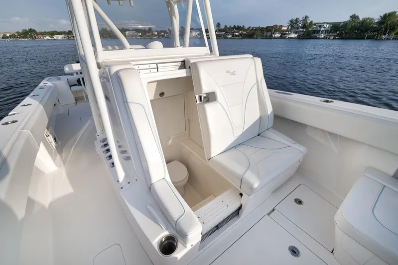  Yacht Photos Pics 2023 SeaVee 322Z boat interior with white seating and open storage compartment.