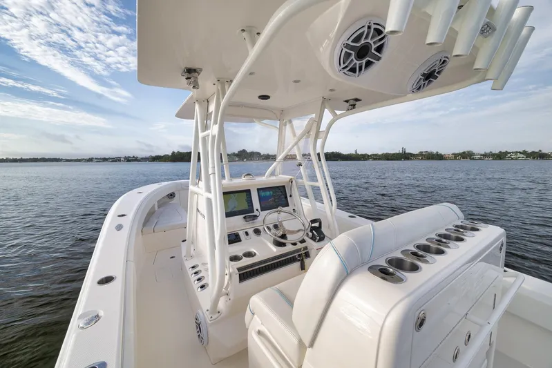  Yacht Photos Pics 2023 SeaVee 322Z boat interior with advanced navigation system on calm waters.
