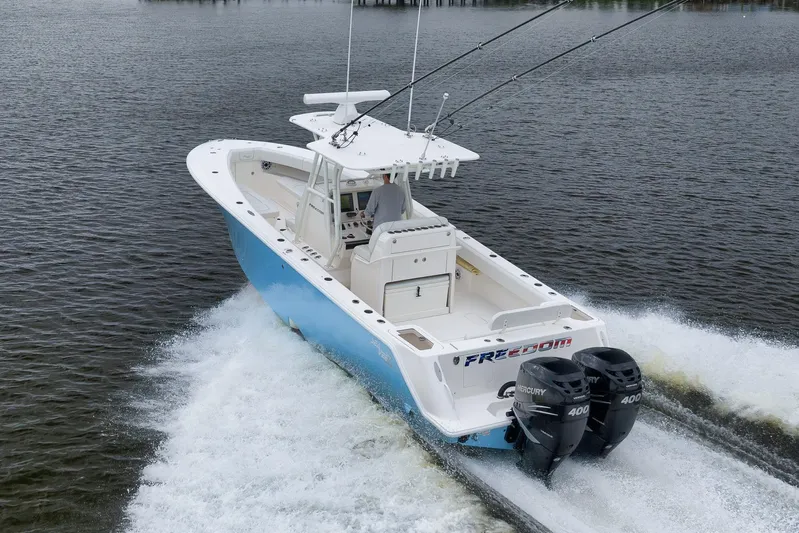  Yacht Photos Pics 2023 SeaVee 322Z boat cruising on water with dual Mercury engines.