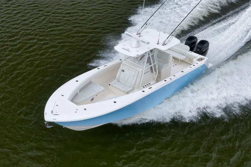  Yacht Photos Pics 2023 SeaVee 322Z boat cruising on water, showcasing sleek design and powerful engines.