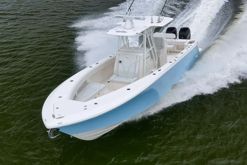  Yacht Photos Pics 2023 SeaVee 322Z boat cruising on water, showcasing sleek design and powerful performance.