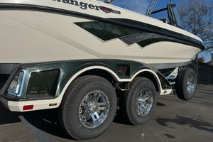 2026 Ranger 620xFS Pro boat with dual-axle trailer, featuring sleek design and chrome wheels.