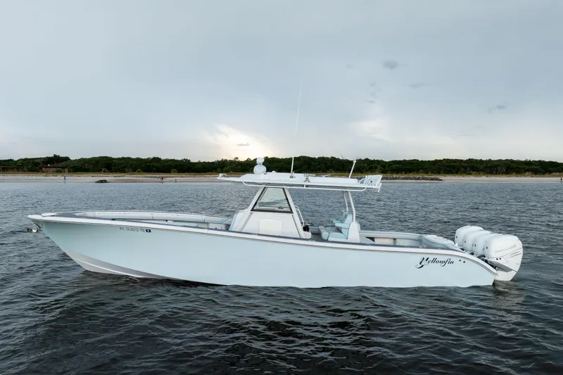  Yacht Photos Pics 2018 Yellowfin 39 Offshore boat on calm water, side view.