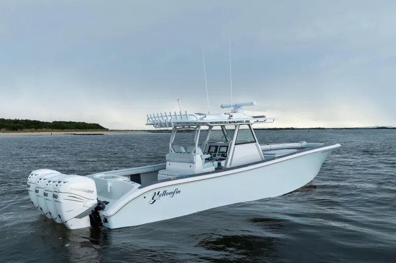  Yacht Photos Pics 2018 Yellowfin 39 Offshore boat with triple Mercury engines on open water.