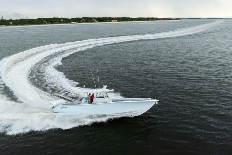  Yacht Photos Pics 2018 Yellowfin 39 Offshore boat cruising on open water, leaving a wake trail.