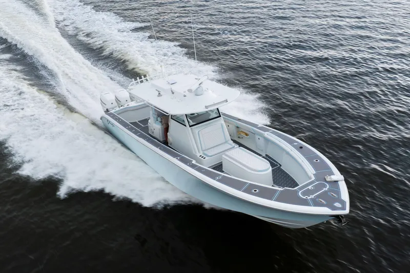  Yacht Photos Pics 2018 Yellowfin 39 Offshore boat cruising on open water, showcasing sleek design and performance.