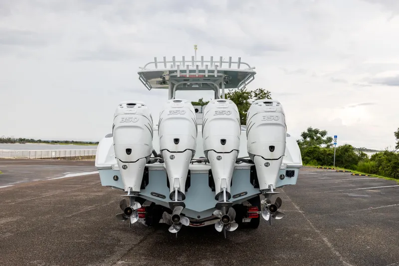  Yacht Photos Pics 2018 Yellowfin 39 Offshore boat with four powerful outboard engines, parked on a cloudy day.