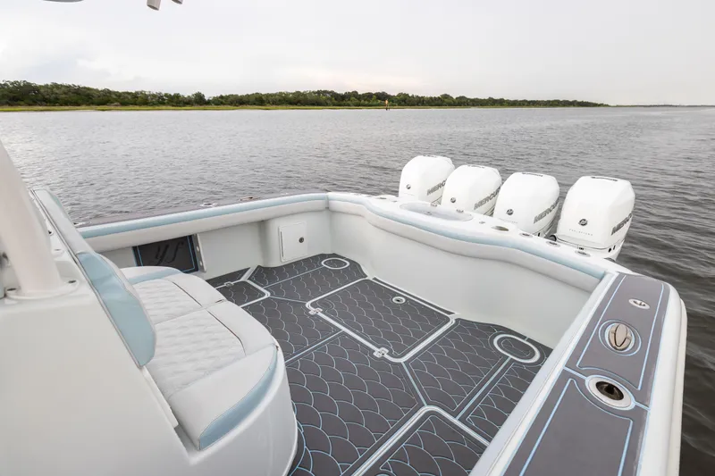  Yacht Photos Pics 2018 Yellowfin 39 Offshore boat with four outboard engines on calm water.