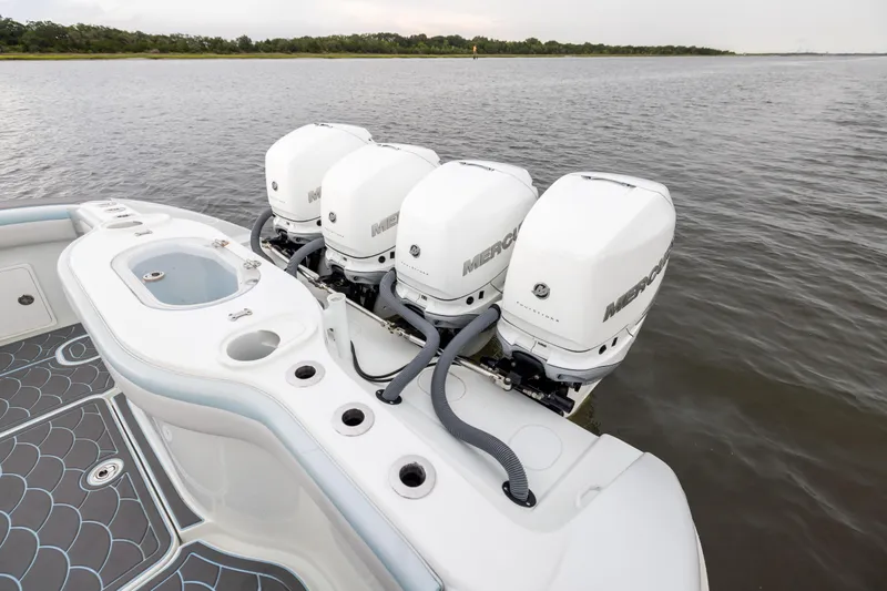  Yacht Photos Pics 2018 Yellowfin 39 Offshore boat with four Mercury outboard engines on calm water.