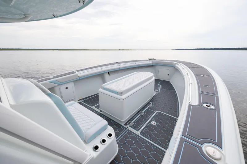  Yacht Photos Pics 2018 Yellowfin 39 Offshore boat interior with seating and storage on calm water.