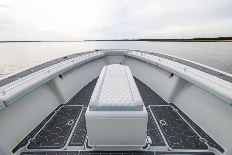  Yacht Photos Pics 2018 Yellowfin 39 Offshore boat interior with cushioned seating and scenic water view.