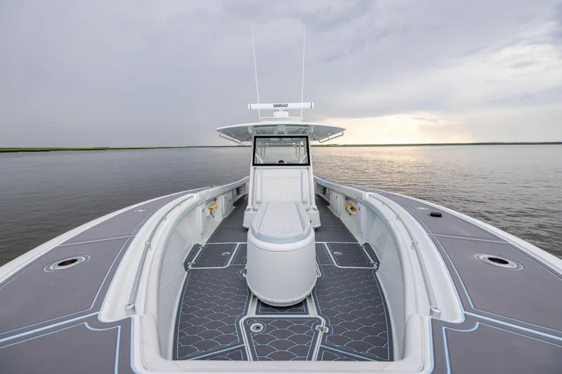  Yacht Photos Pics 2018 Yellowfin 39 Offshore boat on calm water under cloudy sky.