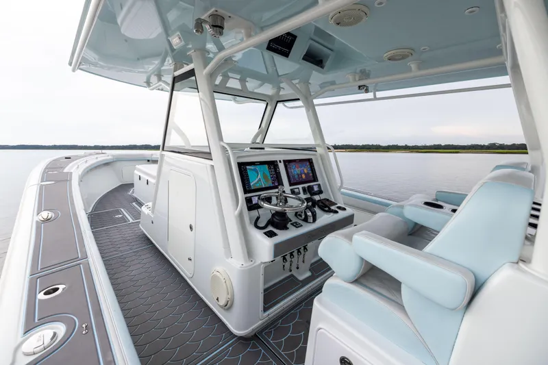  Yacht Photos Pics 2018 Yellowfin 39 Offshore boat interior with modern navigation system and seating.