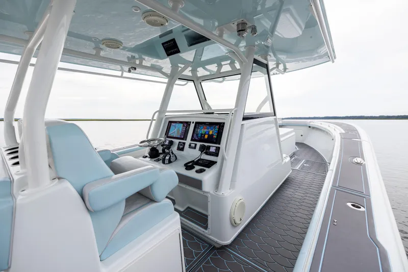  Yacht Photos Pics 2018 Yellowfin 39 Offshore boat interior with advanced navigation system and luxurious seating.