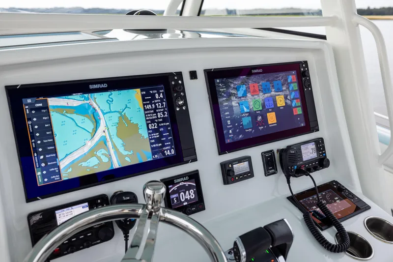  Yacht Photos Pics 2018 Yellowfin 39 Offshore boat dashboard with Simrad navigation displays and controls.