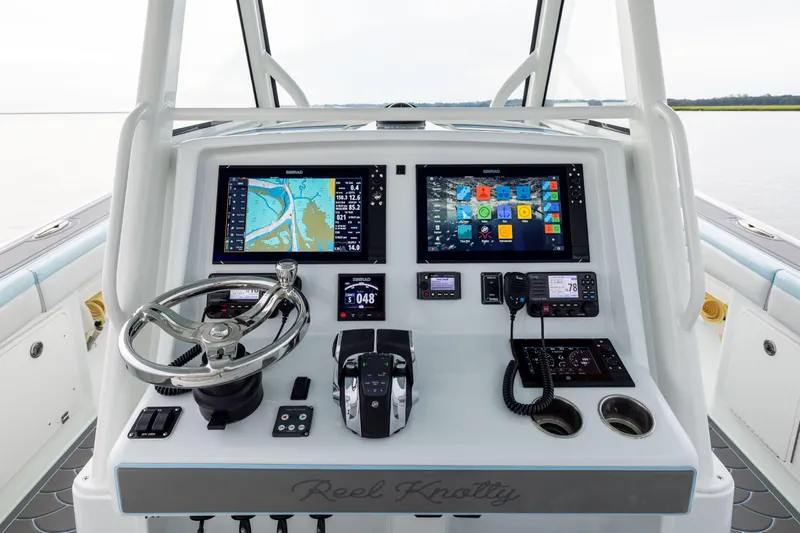  Yacht Photos Pics 2018 Yellowfin 39 Offshore boat dashboard with navigation screens and controls.