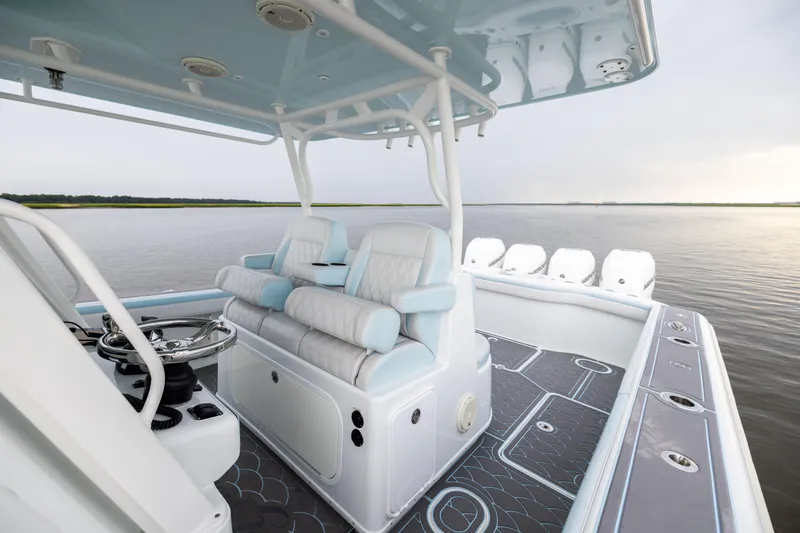  Yacht Photos Pics 2018 Yellowfin 39 Offshore boat interior with luxurious seating and modern design on calm water.