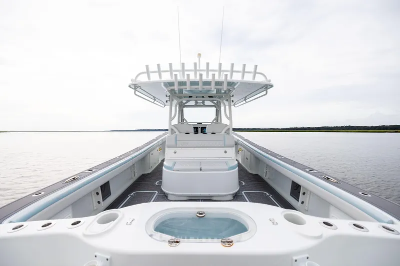  Yacht Photos Pics 2018 Yellowfin 39 Offshore boat interior with spacious deck and seating, on calm water.