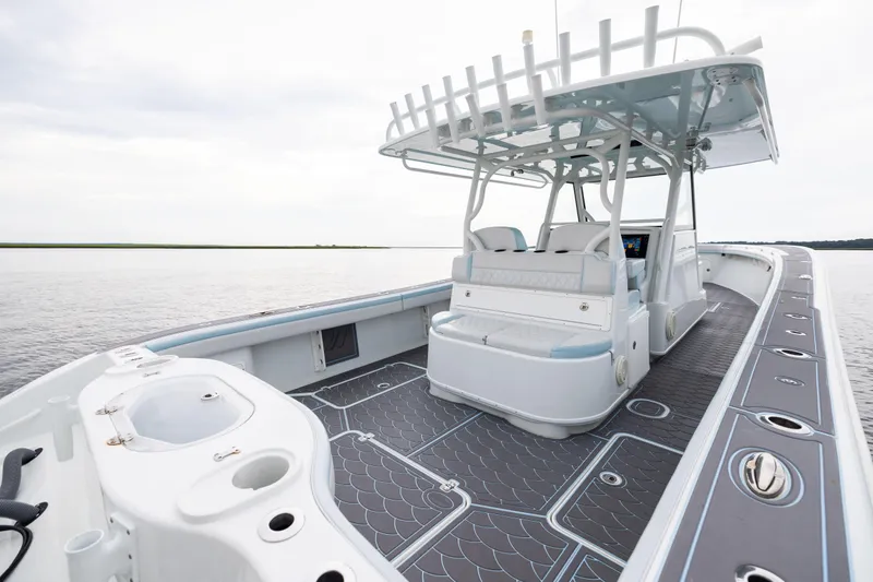  Yacht Photos Pics 2018 Yellowfin 39 Offshore boat with spacious deck and modern seating on calm water.