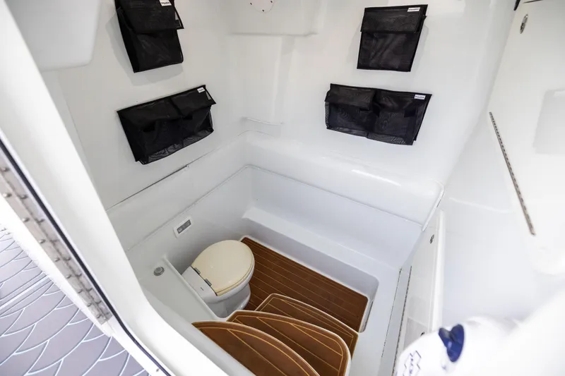  Yacht Photos Pics 2018 Yellowfin 39 Offshore boat interior with toilet and storage compartments.